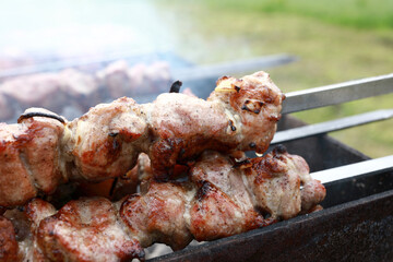 Frying marinated pork on skewers