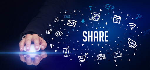 hand holding wireless peripheral with SHARE inscription, social media concept