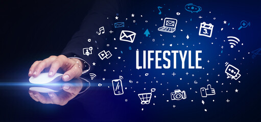 hand holding wireless peripheral with LIFESTYLE inscription, social media concept