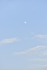 Moon and cloud on blue sky.