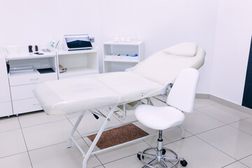 Modern medical examination couch in doctor's office