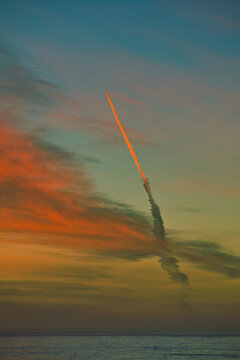 Missile launch at sunset from Vandenberg Air Force base in California