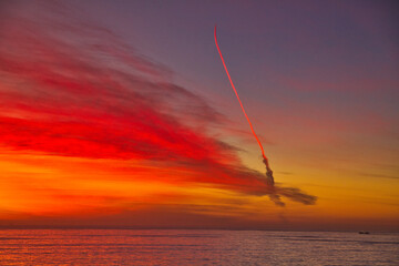 Missile launch at sunset from Vandenberg Air Force base in California