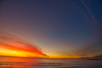 Missile launch at sunset from Vandenberg Air Force base in California
