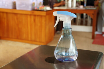 Alcohol sprayer is placed on the counter. Anti-Bacterial Sanitizer Spray.