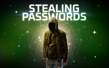 Mysterious hacker with STEALING PASSWORDS inscription, online attack concept inscription, online...