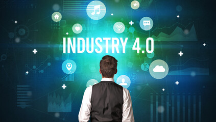 Rear view of a businessman with INDUSTRY 4.0 inscription, modern technology concept