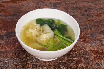 Asian traditional Wonton soup with herbs
