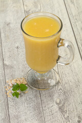 Dietary vegetarian oats milk over wooden