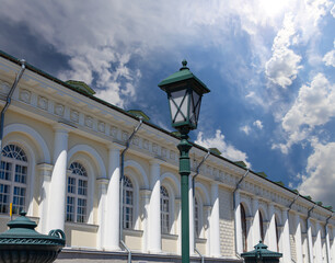 Fototapeta na wymiar Manege Exhibition Hall (Manege Square near the Kremlin) on a cloud background in Moscow. Russia