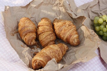 Delicious fresh croissants on a picnic macro