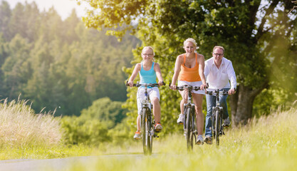 Family having weekend bicycle tour outdoors