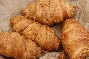 Delicious fresh croissants on a picnic macro