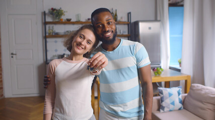Portrait of young couple feeling happy about buying new house.