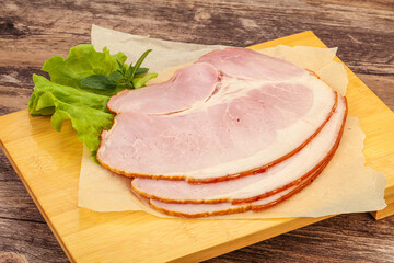 Sliced pork belly over board