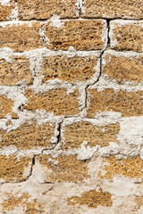 Abstract decorative wall of natural stone. Background, limestone wall texture, shell rock blocks. Great background or texture. Landscape style