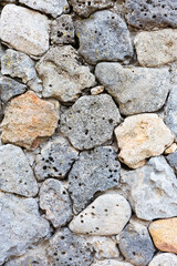 Abstract decorative wall of natural stone. Background, limestone wall texture, shell rock blocks. Great background or texture. Landscape style