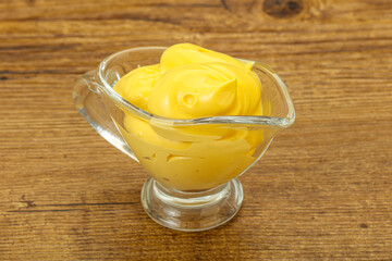 Natural cheese sauce in the bowl