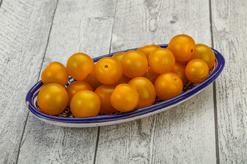 Fresh yellow cherry tomato heap