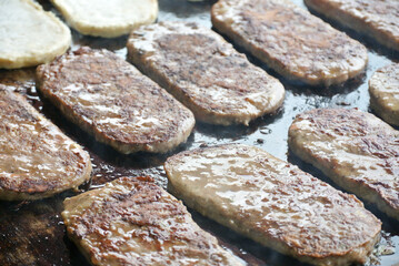Burger meat being grilled
