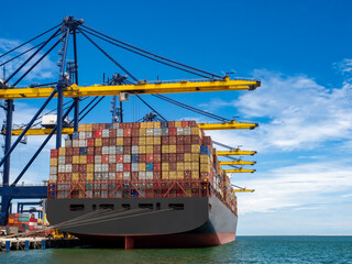 The container vessel during discharging at an industrial port and move containers to container's...