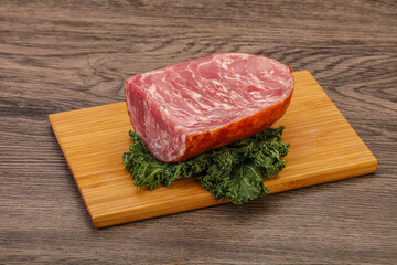 Beef ham piece over board