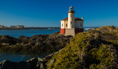 Fototapeta na wymiar Bandon Lighthouse on the Oregon coast and Coquille River near Bandon.