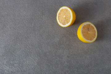 Cut lemon on a gray  background