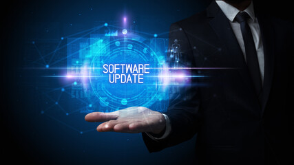 Man hand holding SOFTWARE UPDATE inscription, technology concept