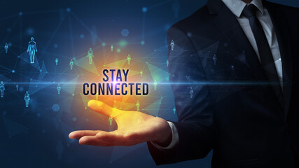 Elegant hand holding STAY CONNECTED inscription, social networking concept