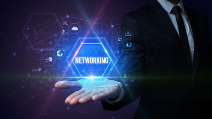 Man hand holding NETWORKING inscription, social media concept