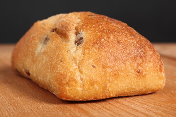 Ciabatta with black olives. Italian white bread.