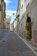 Fototapeta na wymiar A street between the houses of the old town of Santa Maria del Molise, Italy.