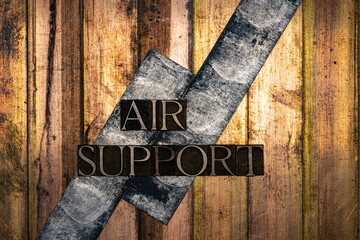 Air Support text formed with real authentic typeset letters on vintage textured silver grunge...