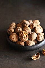 Walnuts . Dark background, Close up. Selective focus