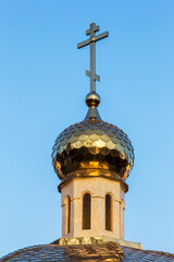 Golden dome with a cross of the Orthodox Cathedral