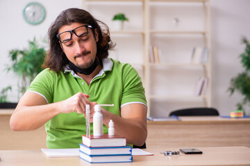 Young man student studying at home in self-isolation concept