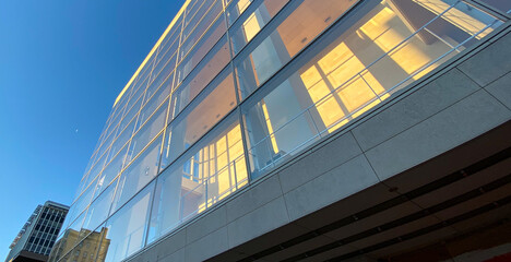Fototapeta na wymiar yellow modern office building with blue sky