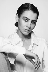 Vintage style black and white portrait of young beautiful tomboy