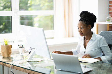 Happy Professional Woman Employee Using Computer