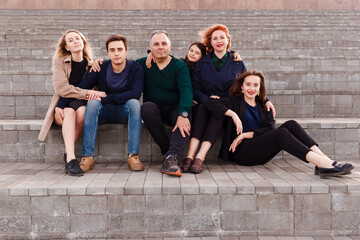 Fototapeta premium a large family of children and parents. a family of six look into the camera.