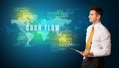 Businessman in front of a decision with CASH FLOW inscription, business concept