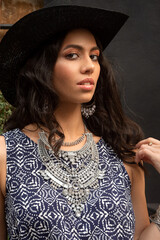 Beautiful smiling young south girl boho style clothing and jewelry