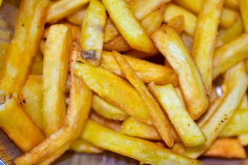 Delicious French fries close up as background