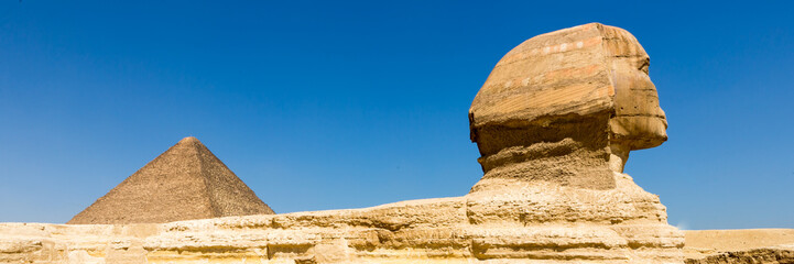 The pyramids at Giza in Egypt. Web banner in panoramic view.