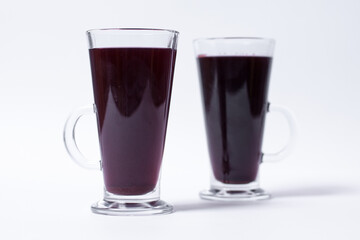 two glasses with sweet strawberry juice isolated