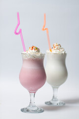 milkshake cocktail with pink straw and marshmallow isolated