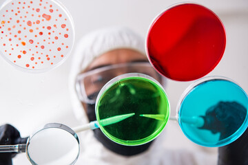 Young male chemist working in the lab