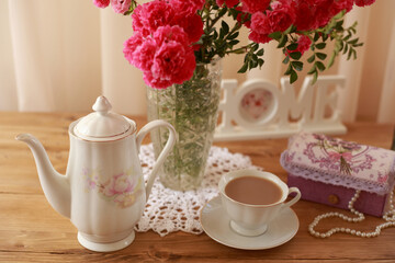 summer morning with the scent of roses and tea with milk