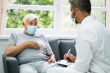 Doctor Talking To Elderly Patient